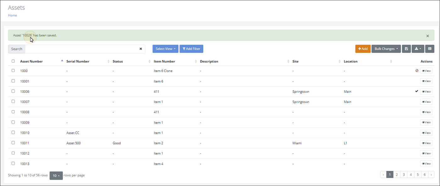Assets page with the confirmation message Asset '10026' has been saved, showing the generated asset number