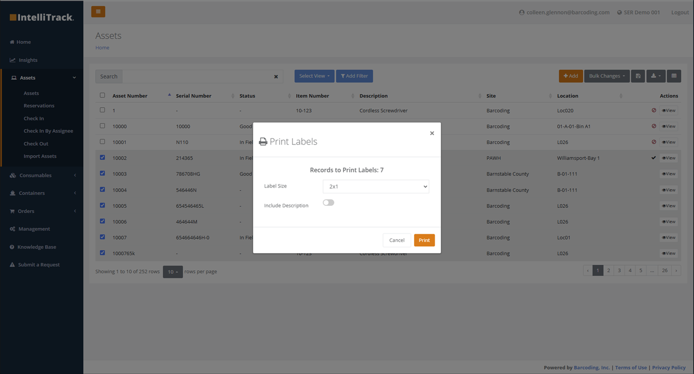 Print Labels popup showing Records to Print Labels: 7, a Label Size drop-down set to 2x1 and the Include Description toggle